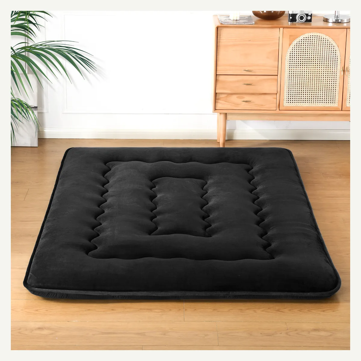 Black Channel-Tufted Floor Mattress — room setting